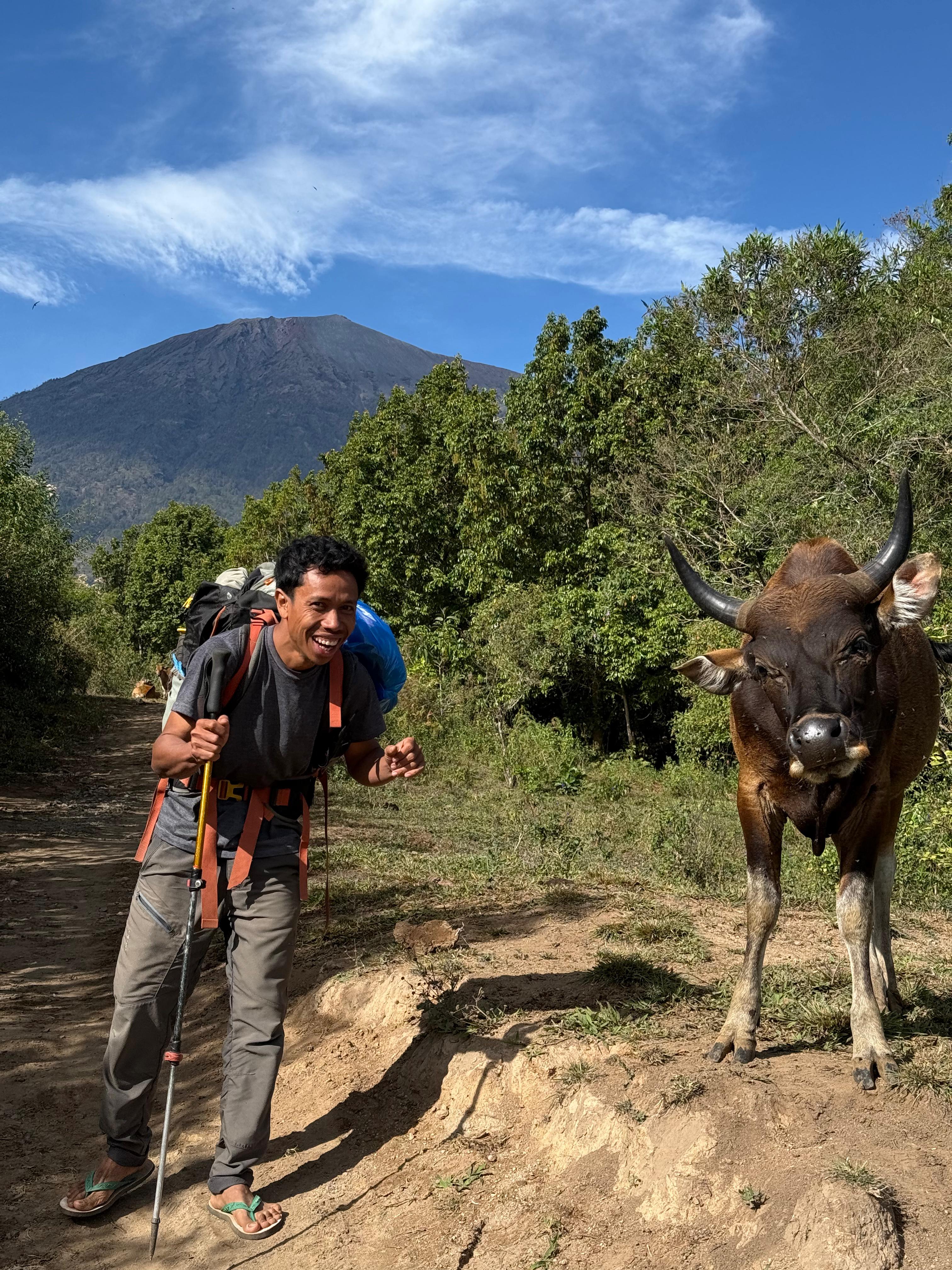 Pak Wil on the lower Rinjani trail with the mountain behind him