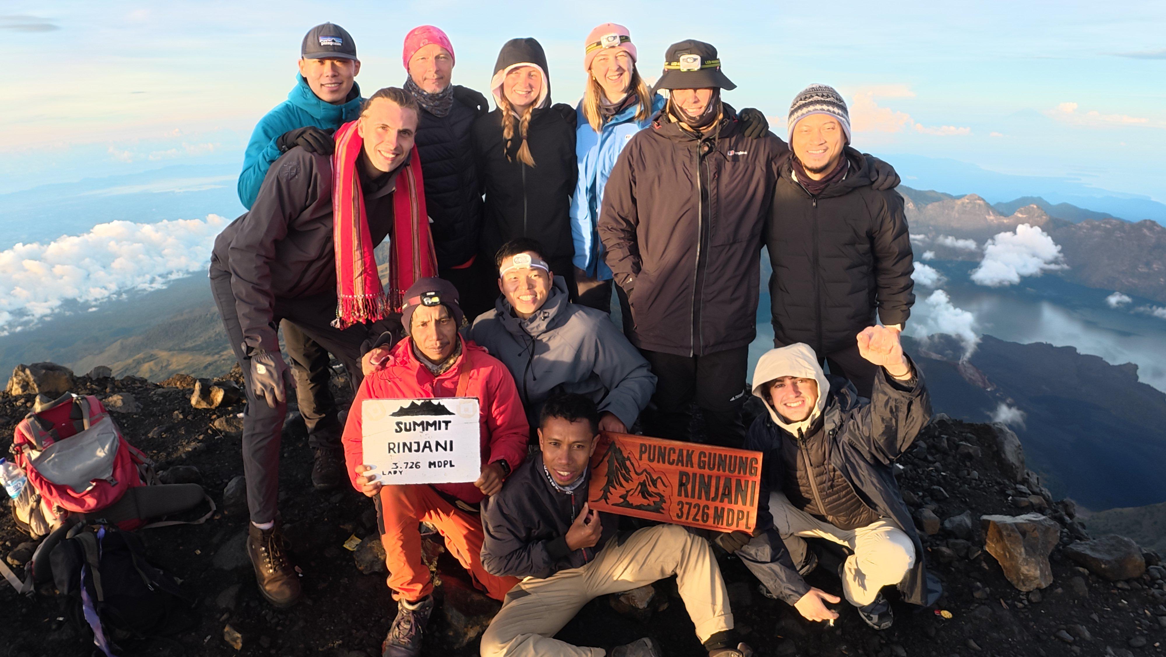 Pak Wil and the Wil Rinjani team with trekkers at the 3,726 m summit